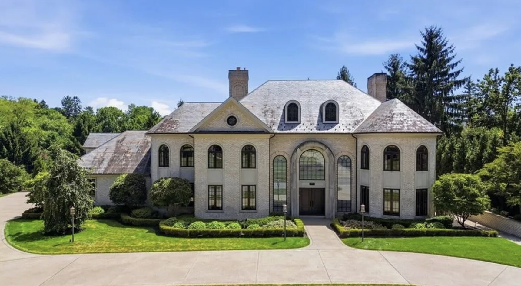 French-country style estate home with expansive lawn and circular drive, South Hills Pittsburgh luxury real estate