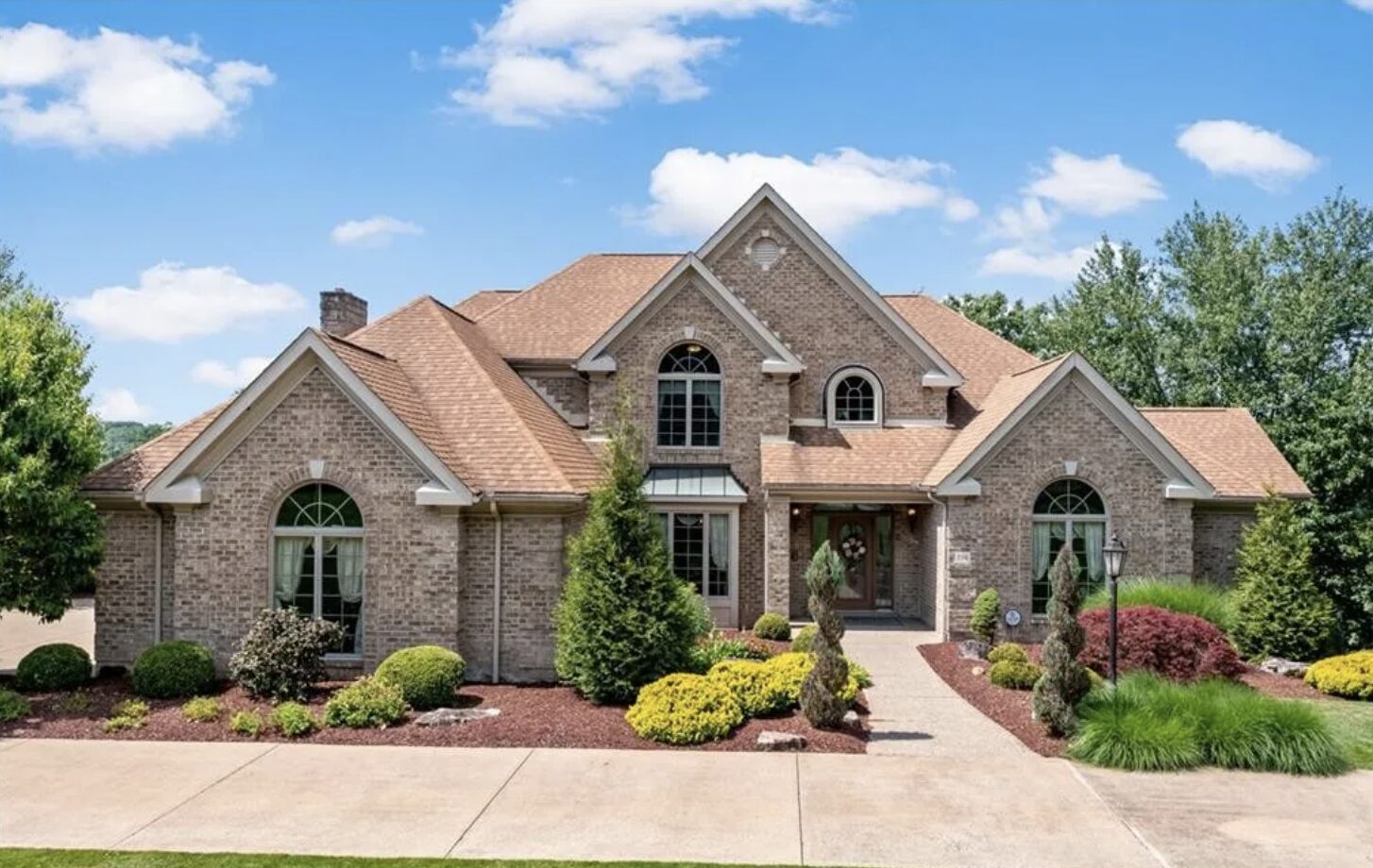 Executive brick traditional home with landscaped entrance, South Hills Pittsburgh luxury real estate